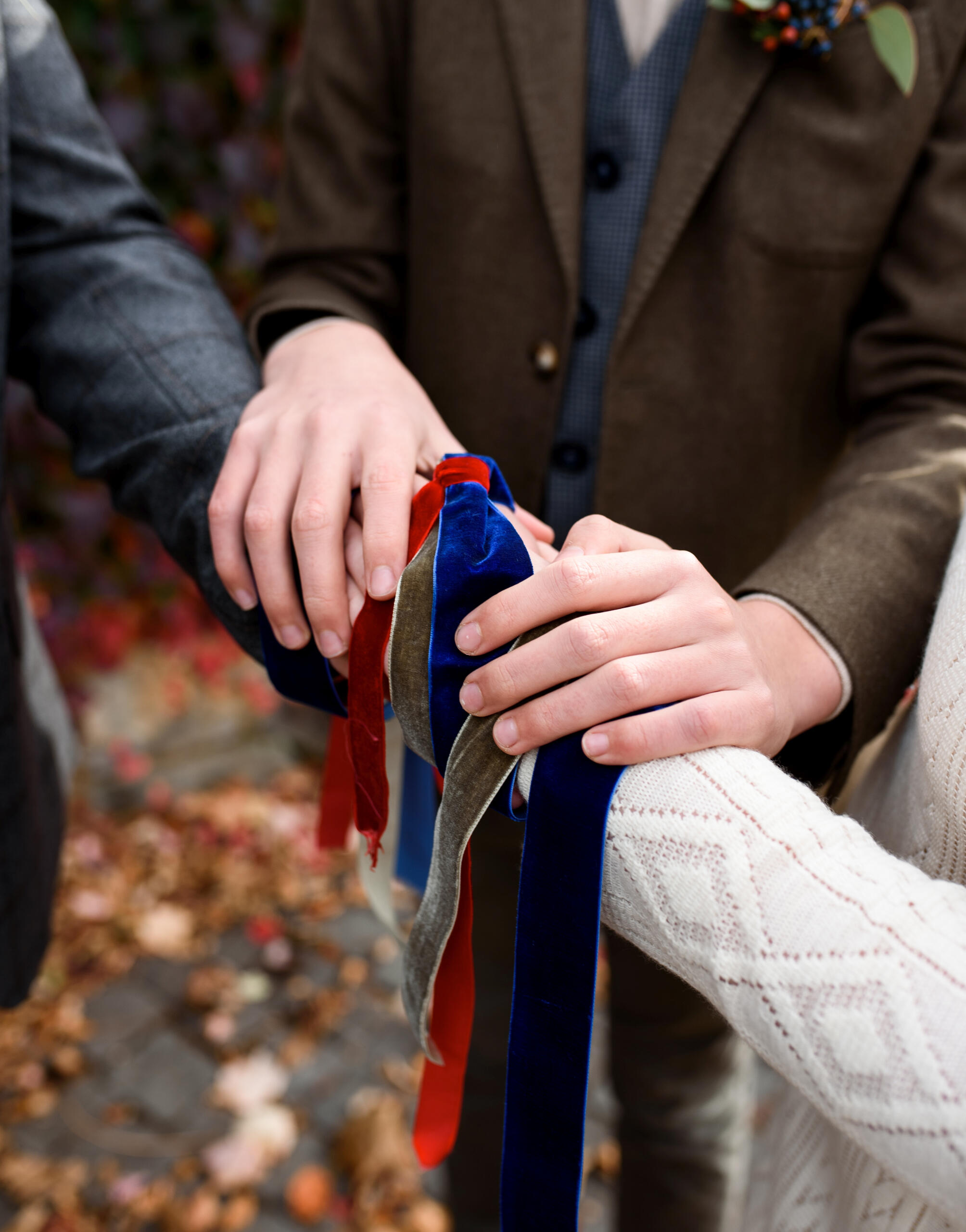 Hand-fasting Couple having a symbolic hand-fasting at a wedding ceremony